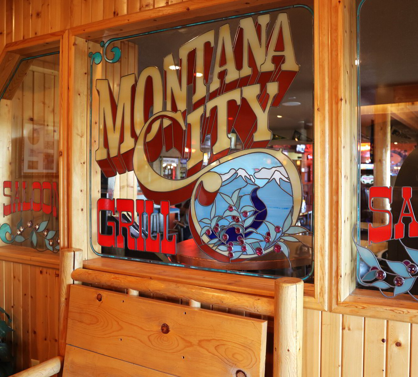 Warm interior ambiance inside Montana City Grill with soft lighting and rustic decor